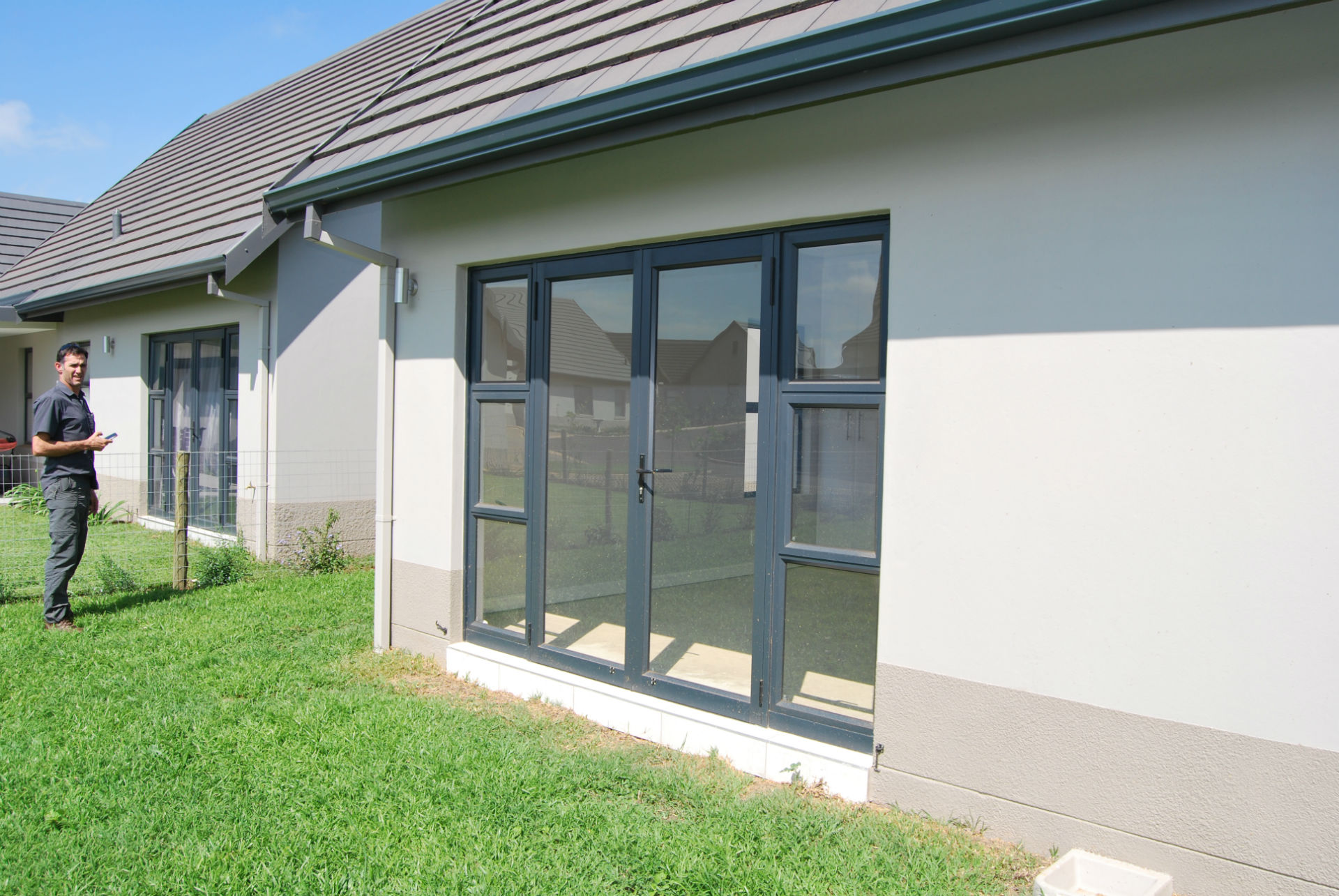 Top hung aluminium windows installed in a residential building in KZN, showcasing durable aluminium window frames.