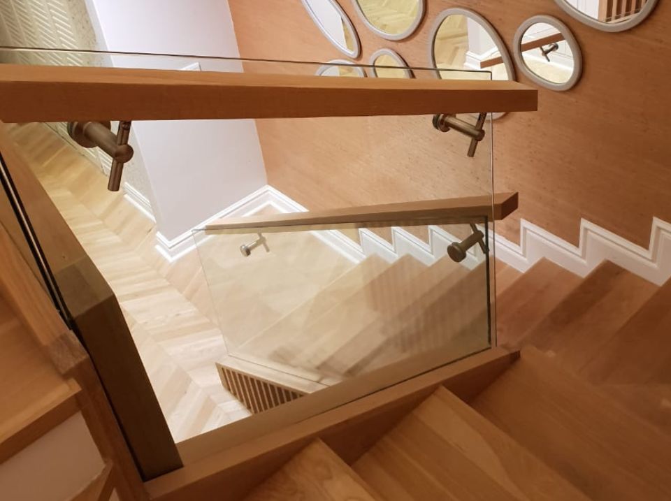 balustrade Aluminium sliding door design with glass panels, opening to a covered patio in a modern residential setting.