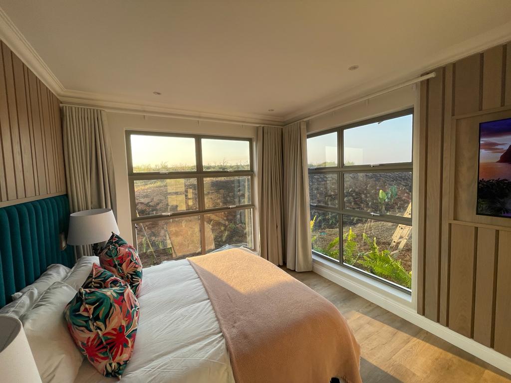 Top hung windows Top hung aluminium windows installed in a residential building in KZN, showcasing durable aluminium window frames.