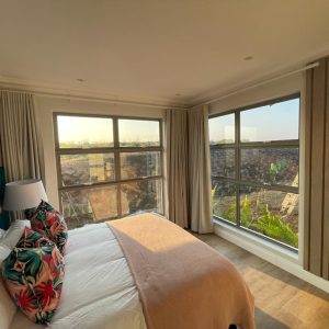 Top hung aluminium windows installed in a residential building in KZN, showcasing durable aluminium window frames.
